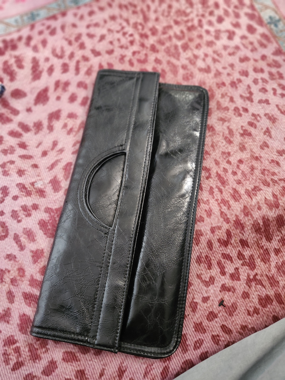 Womens Black Leather Foldover Clutch Bag With Magnetic Closure.